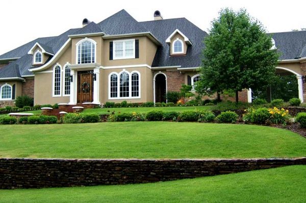Artificial grass lawn in front of a house